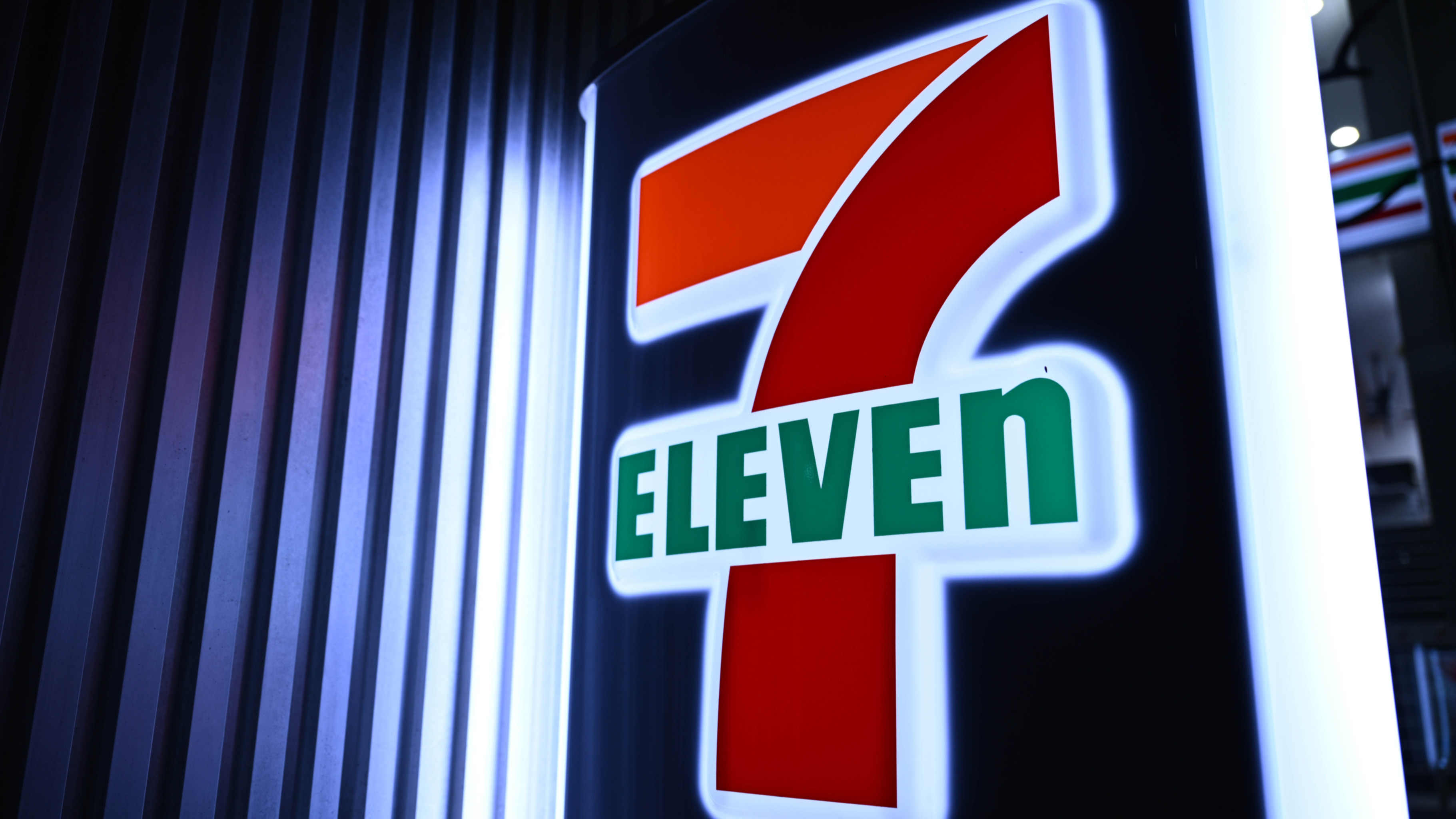 7-Eleven logo with the text "ELEVEN" in green, symbolizing tech investment.