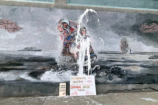 Berkeley mural vandalism: White paint splattered on immigrant-themed artwork.