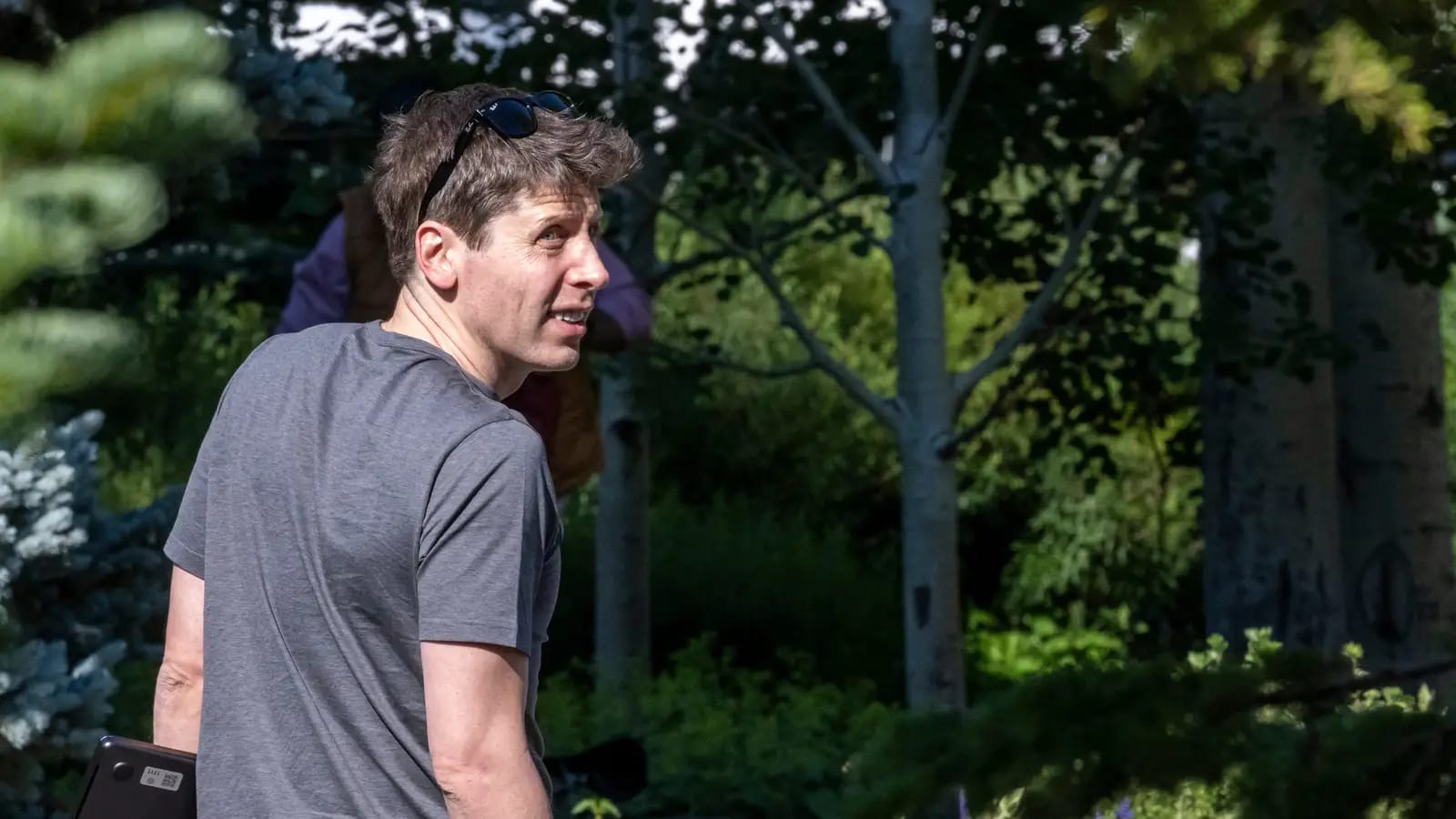 Sam Altman at a tech influencer retreat, OpenAI's ChatGPT.
