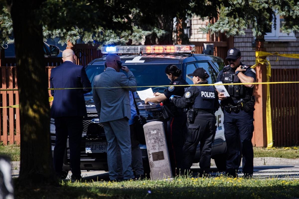 Police at Toronto shooting scene. Politics and crime.