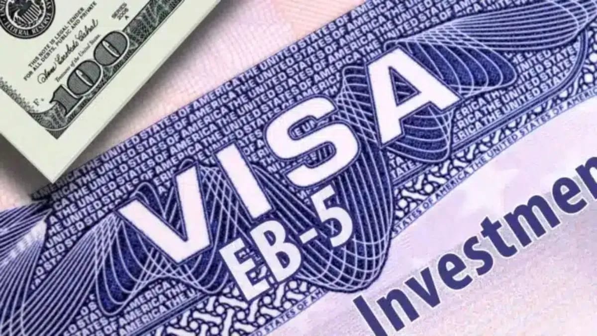 EB-5 visa with US dollar bill, representing investment immigration