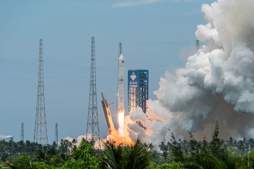 Chinese Long March rocket launches, demonstrating reusable rocket technology and cost-cutting in space missions.