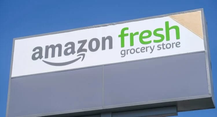 Amazon Fresh grocery store sign, relevant to business news.