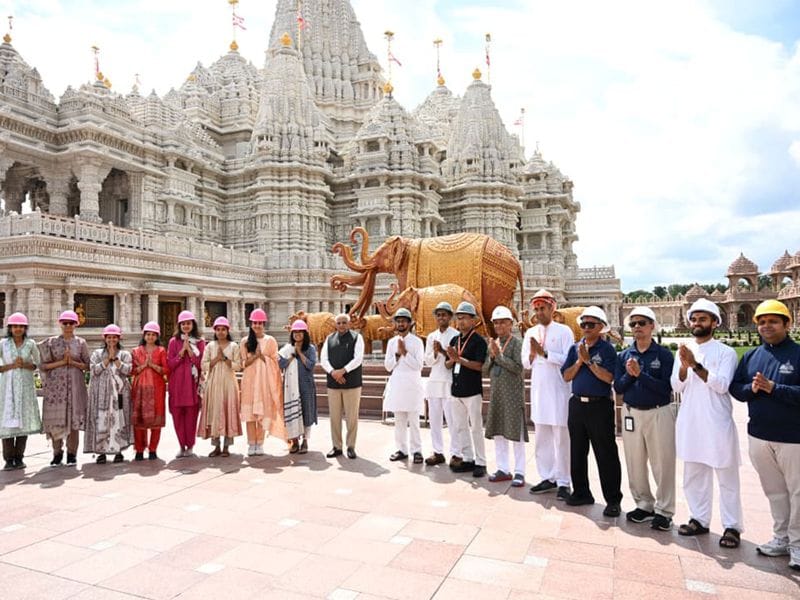 Gujarat CM Patel and dignitaries at NJ Akshardham Temple, showcasing Indian culture.