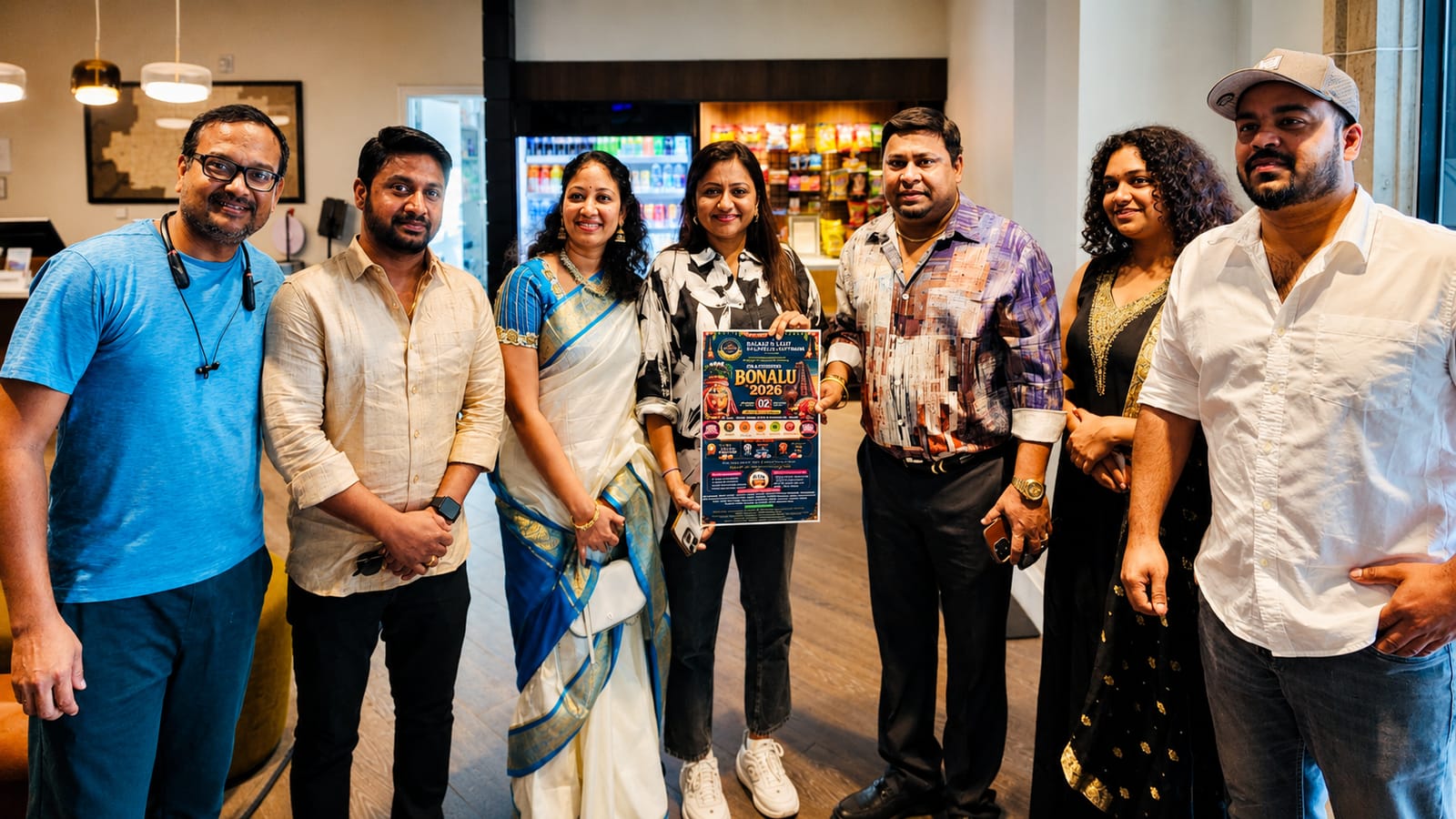 Frisco Mayor joins Telugu community at Bonalu festival, holding a flyer.