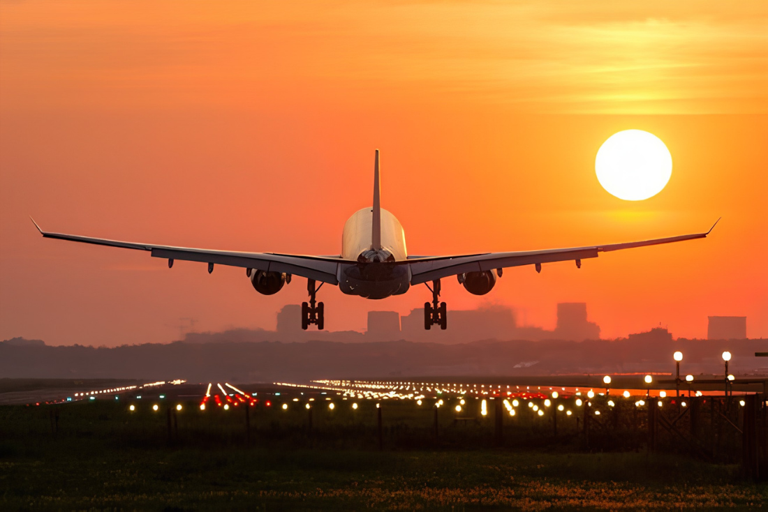 Airplane landing at sunset, symbolizing new business routes to India