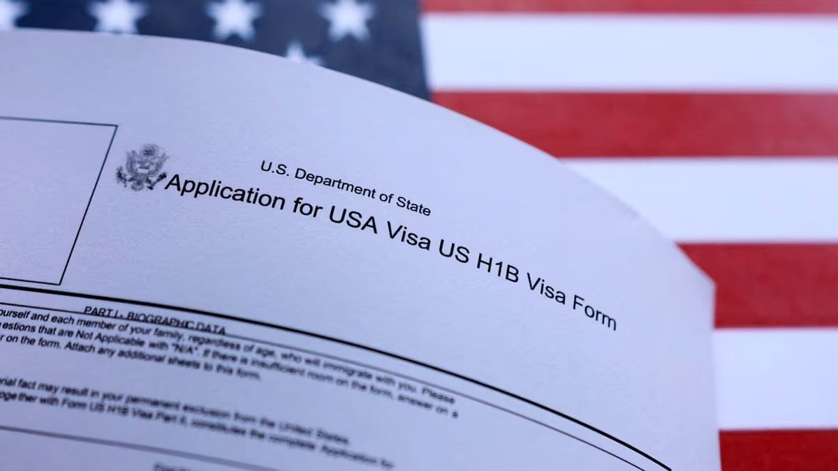 H-1B visa application form with US flag background, relevant to visa and immigration news.