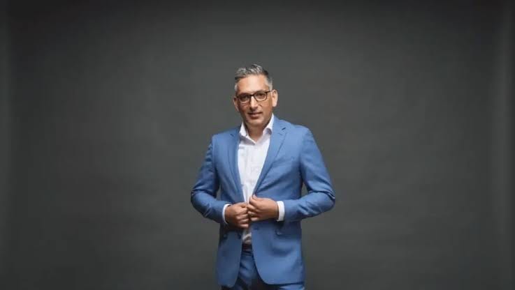 Vaibhav Vohra, new CEO of Epicor Software, in a blue tech suit.
