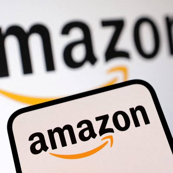 Amazon logo on a phone screen, representing tech investment.