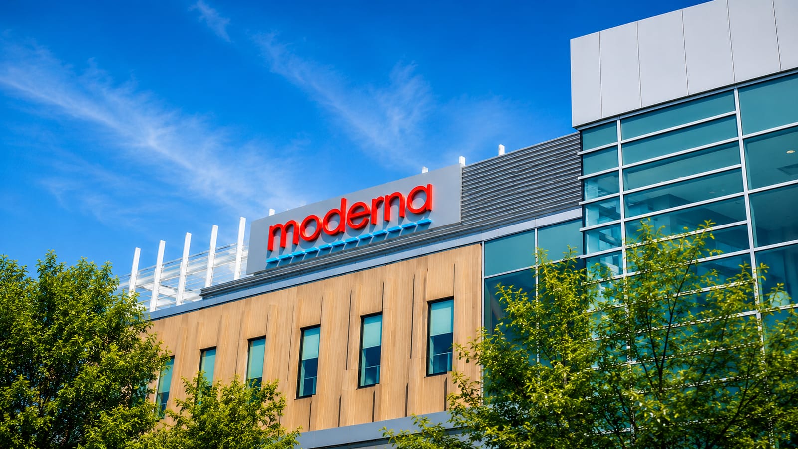 Moderna building exterior with its logo, news about mRNA flu vaccine.