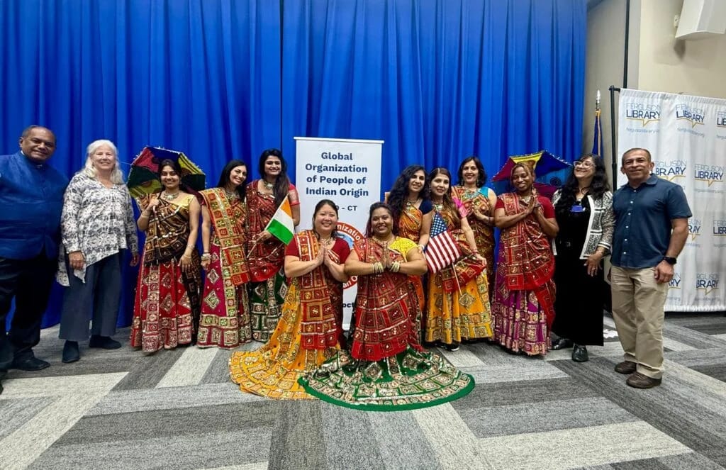 GOPIO-CT members in Indian attire at Stamford WorldFest news event.