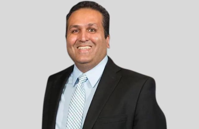 Ajay Bhutoria, immigration advocate, opposes DHS H-1B grace period changes.