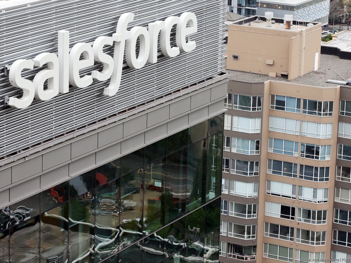 Salesforce building exterior with large sign, news of Washington State job cuts