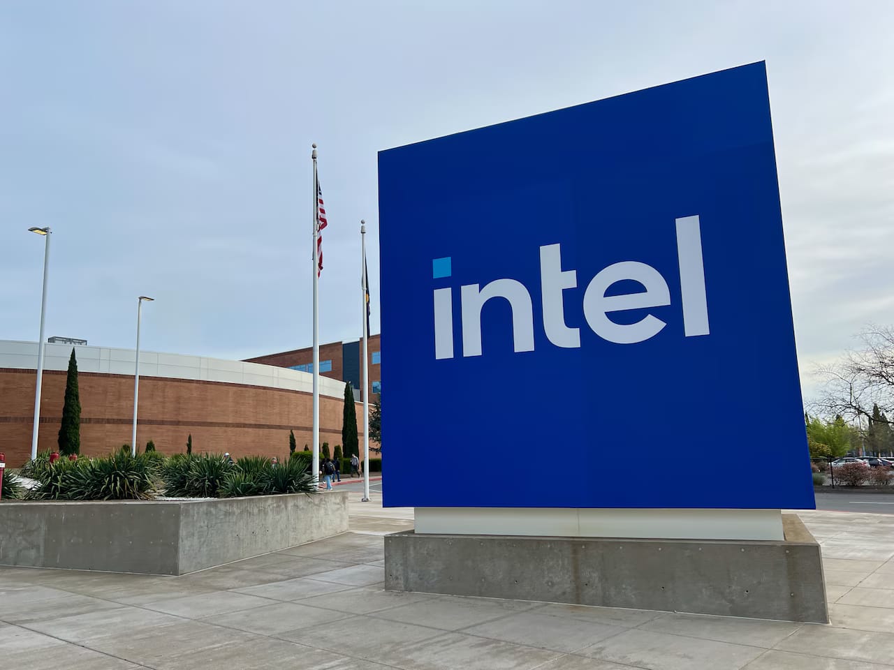 Large blue Intel sign outside a modern business building