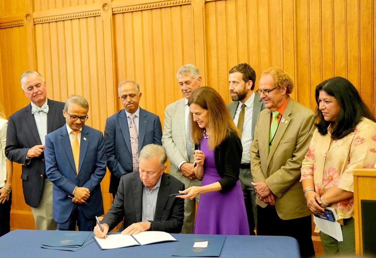 Connecticut Governor signs India Trade Commission bill with business leaders.