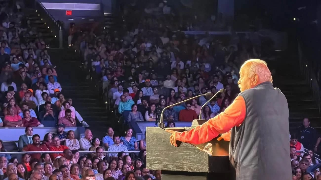 RSS Chief Mohan Bhagwat addresses diaspora at a news event, urging them to serve adopted nations while retaining Indian values.